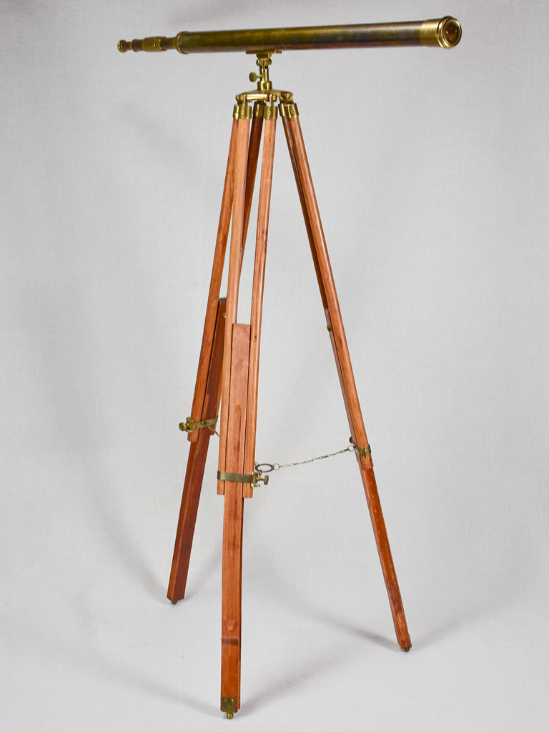 Vintage telescope on wooden tripod