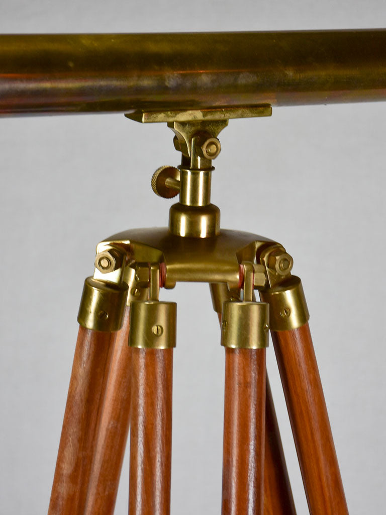 Vintage telescope on wooden tripod