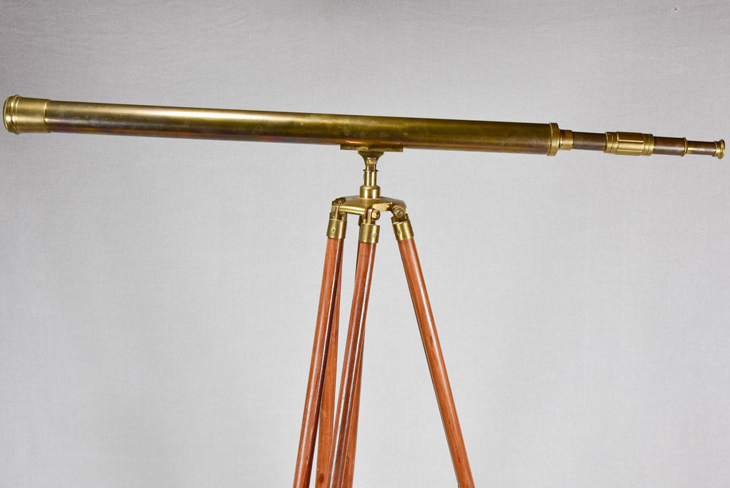 Vintage telescope on wooden tripod