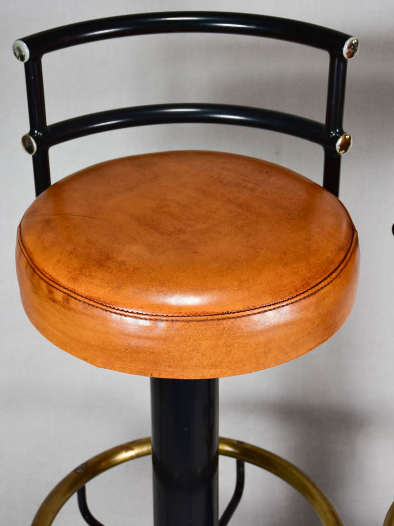 Three 1960s French leather barstools