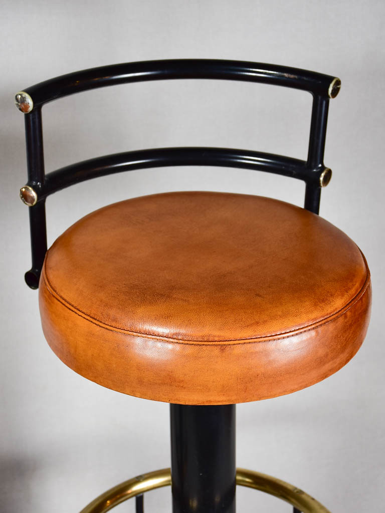 Three 1960s French leather barstools