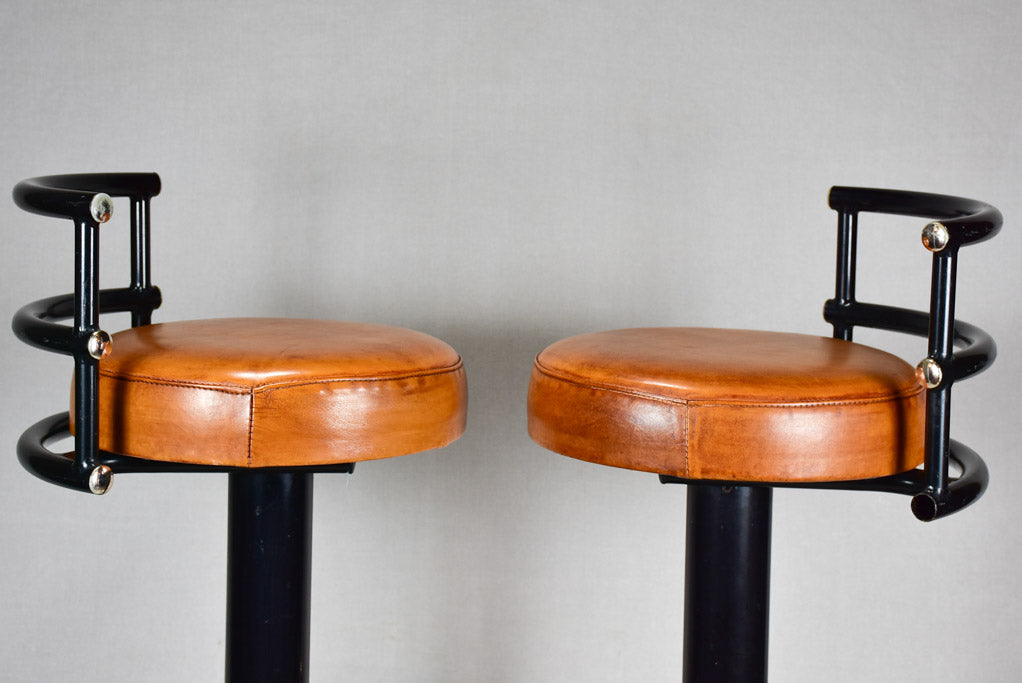 Three 1960s French leather barstools