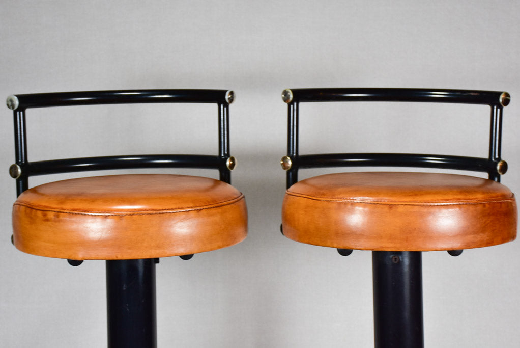 Three 1960s French leather barstools