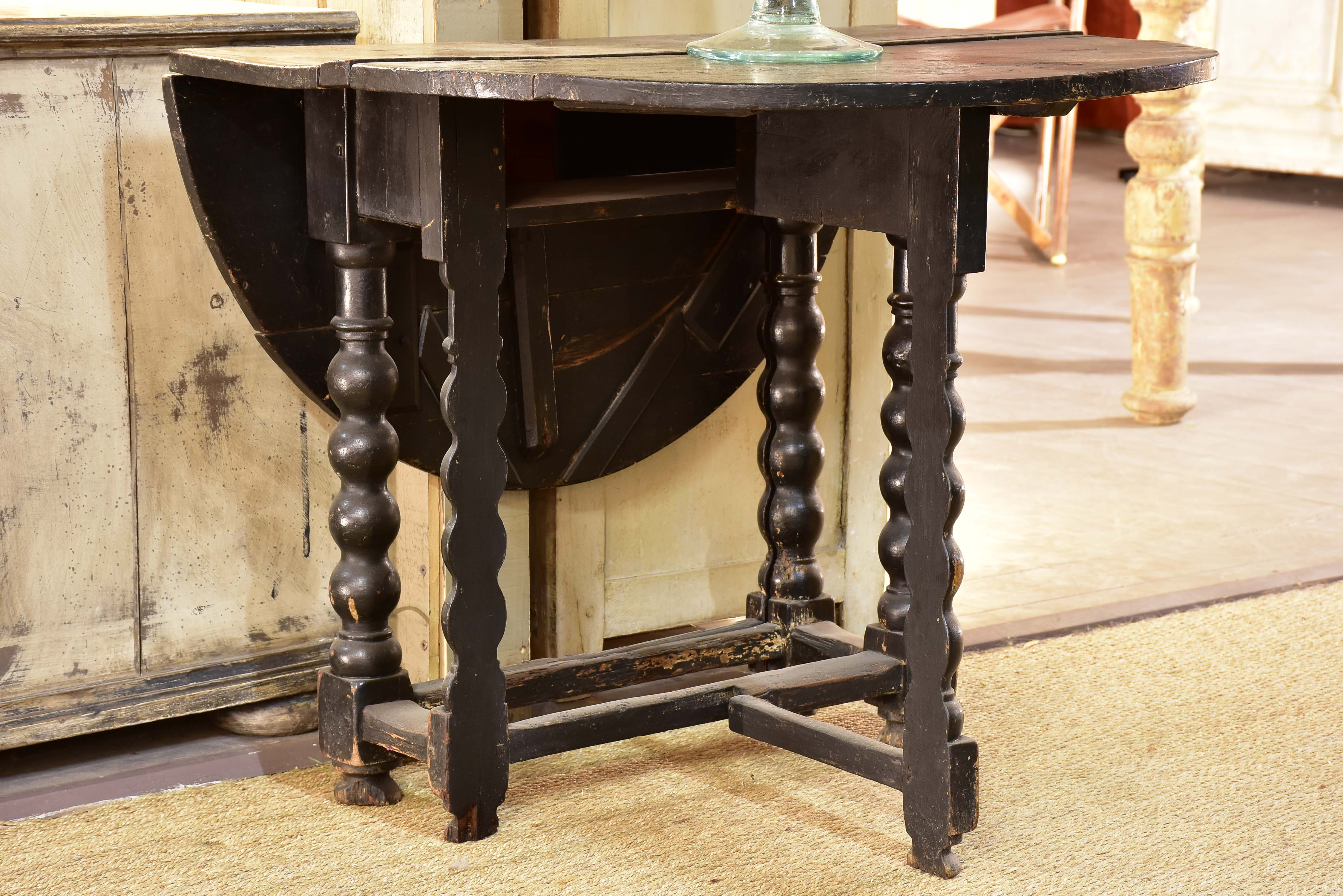 Black drop leaf table Louis XIV