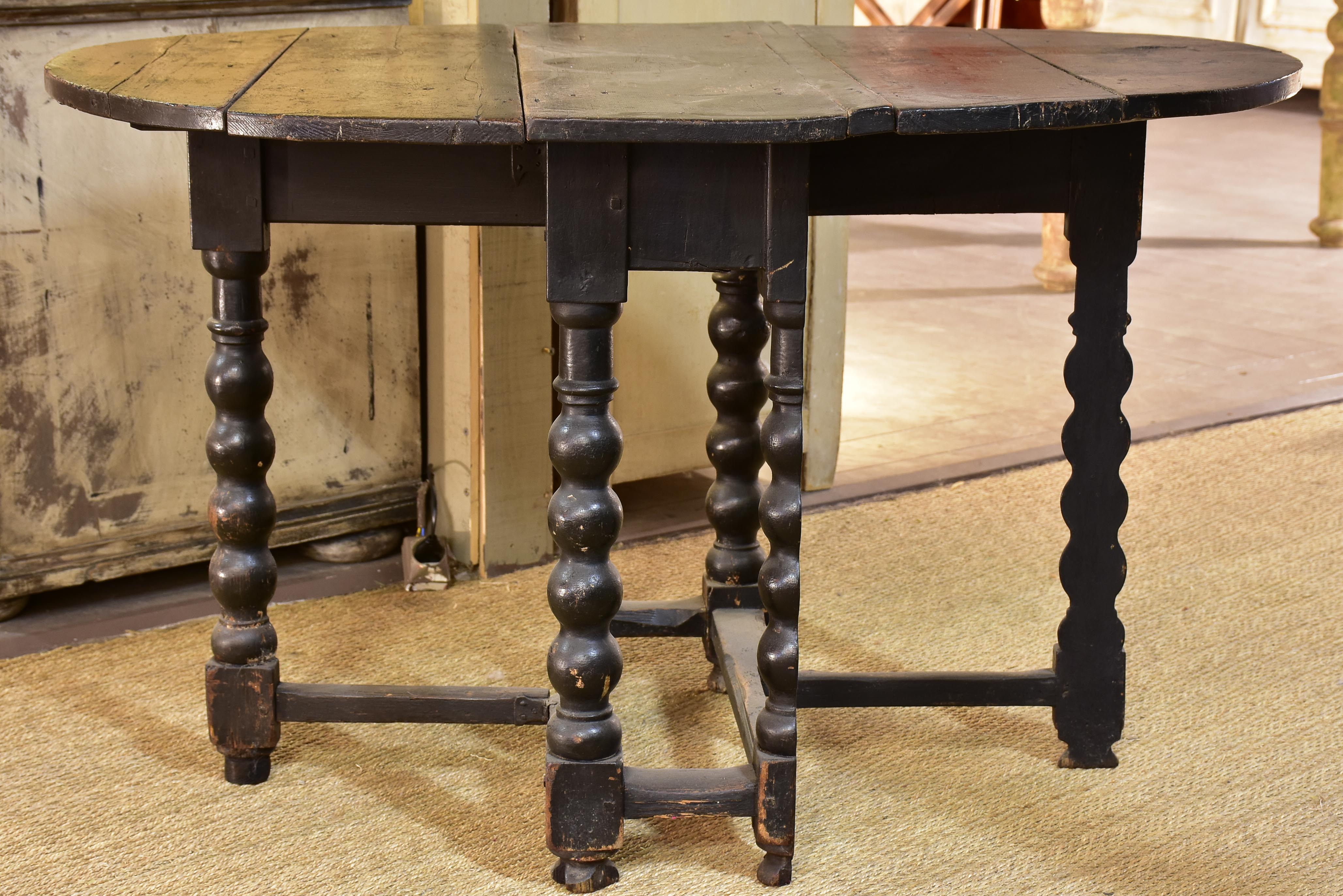 Black drop leaf table Louis XIV