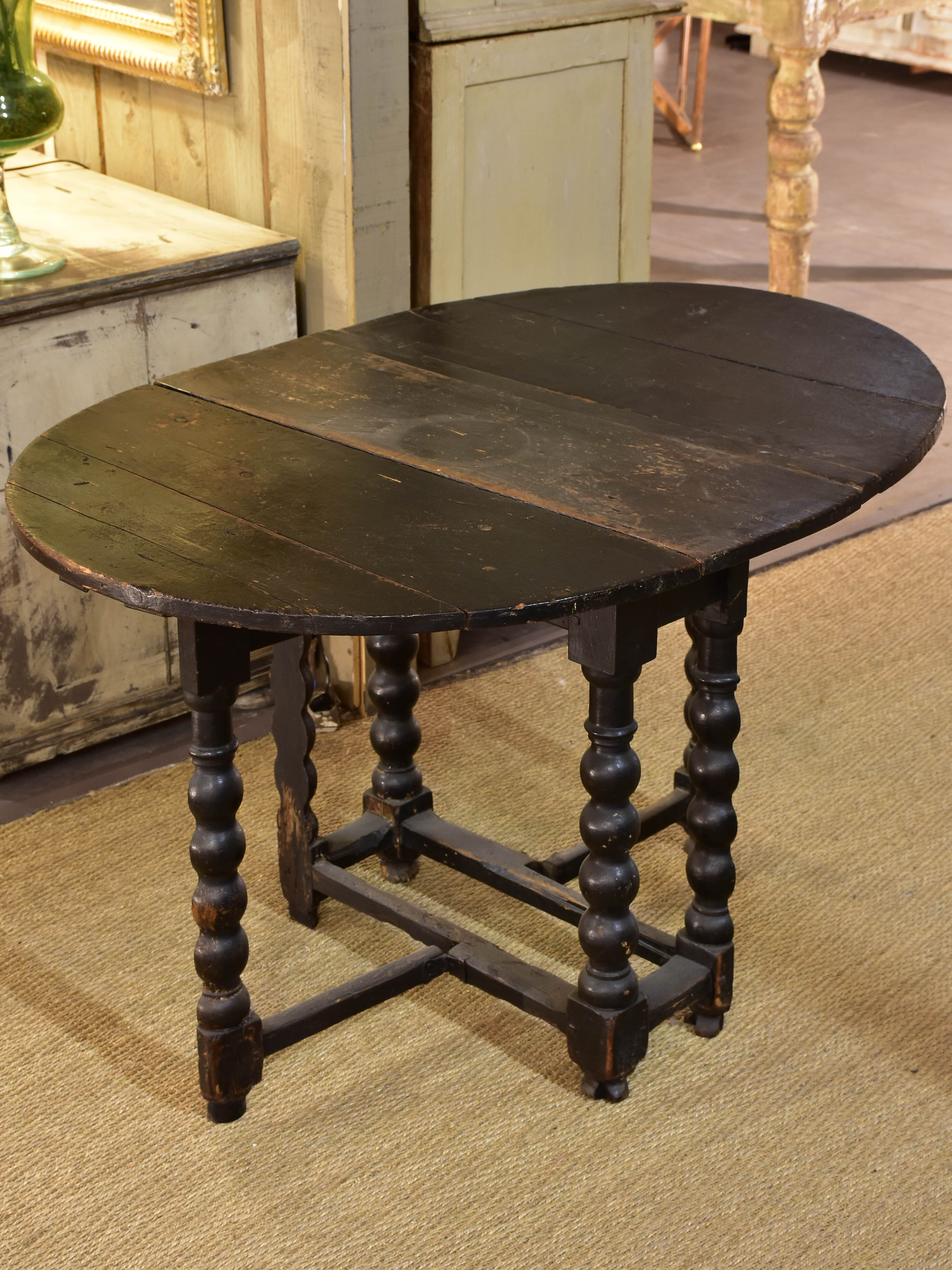 Black drop leaf table Louis XIV