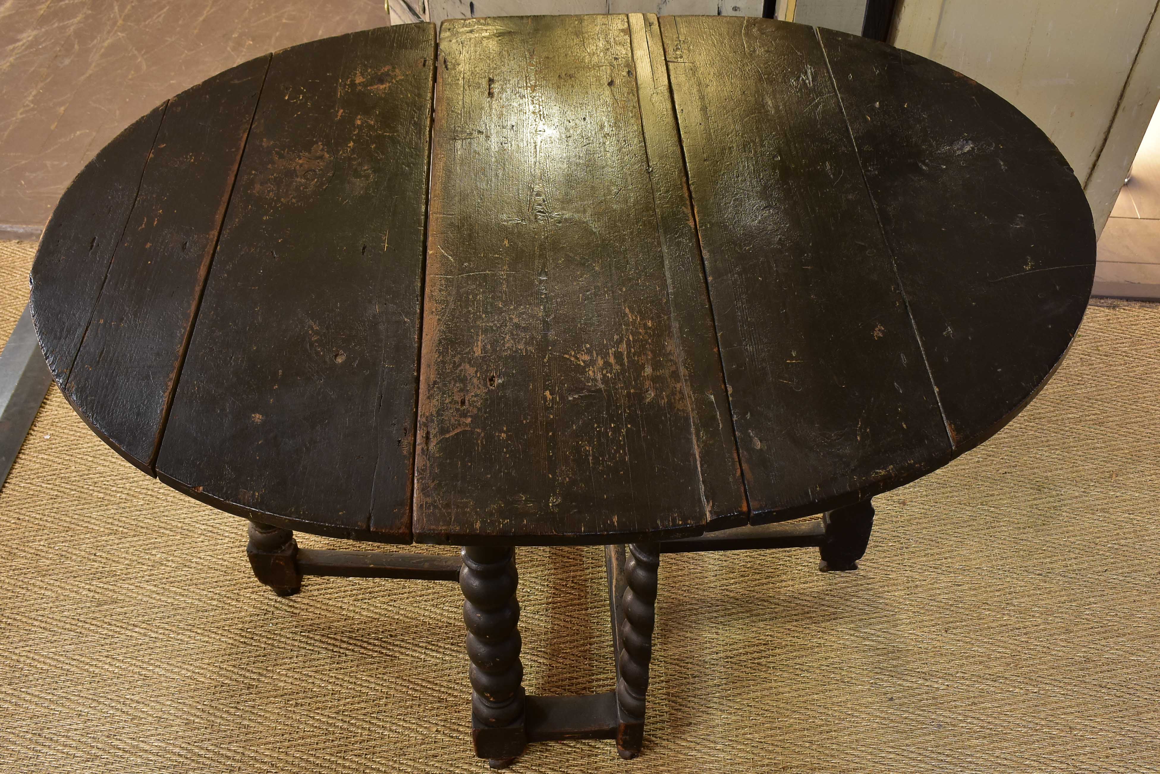 Black drop leaf table Louis XIV