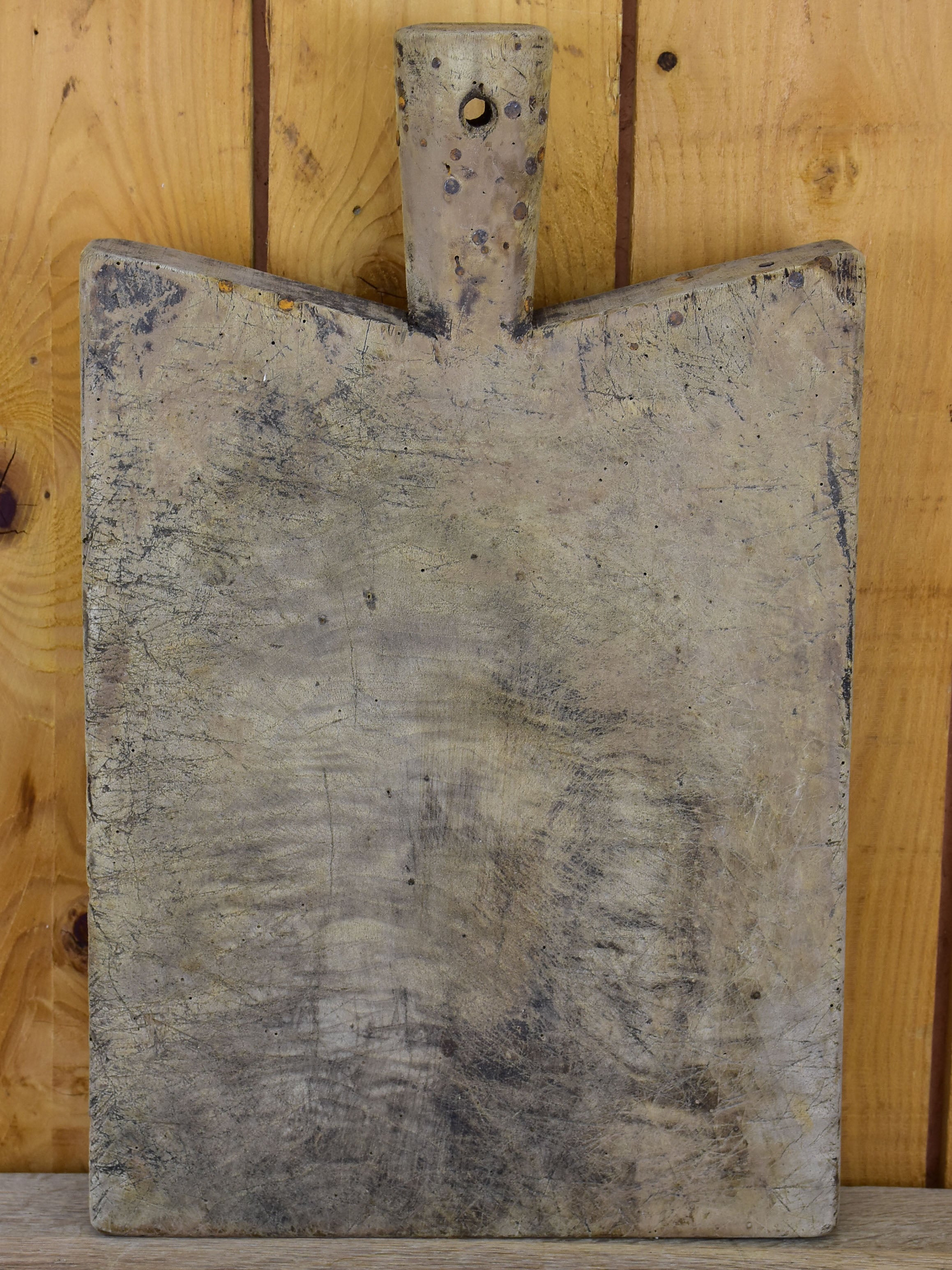 Antique French cutting board with peaked shoulders