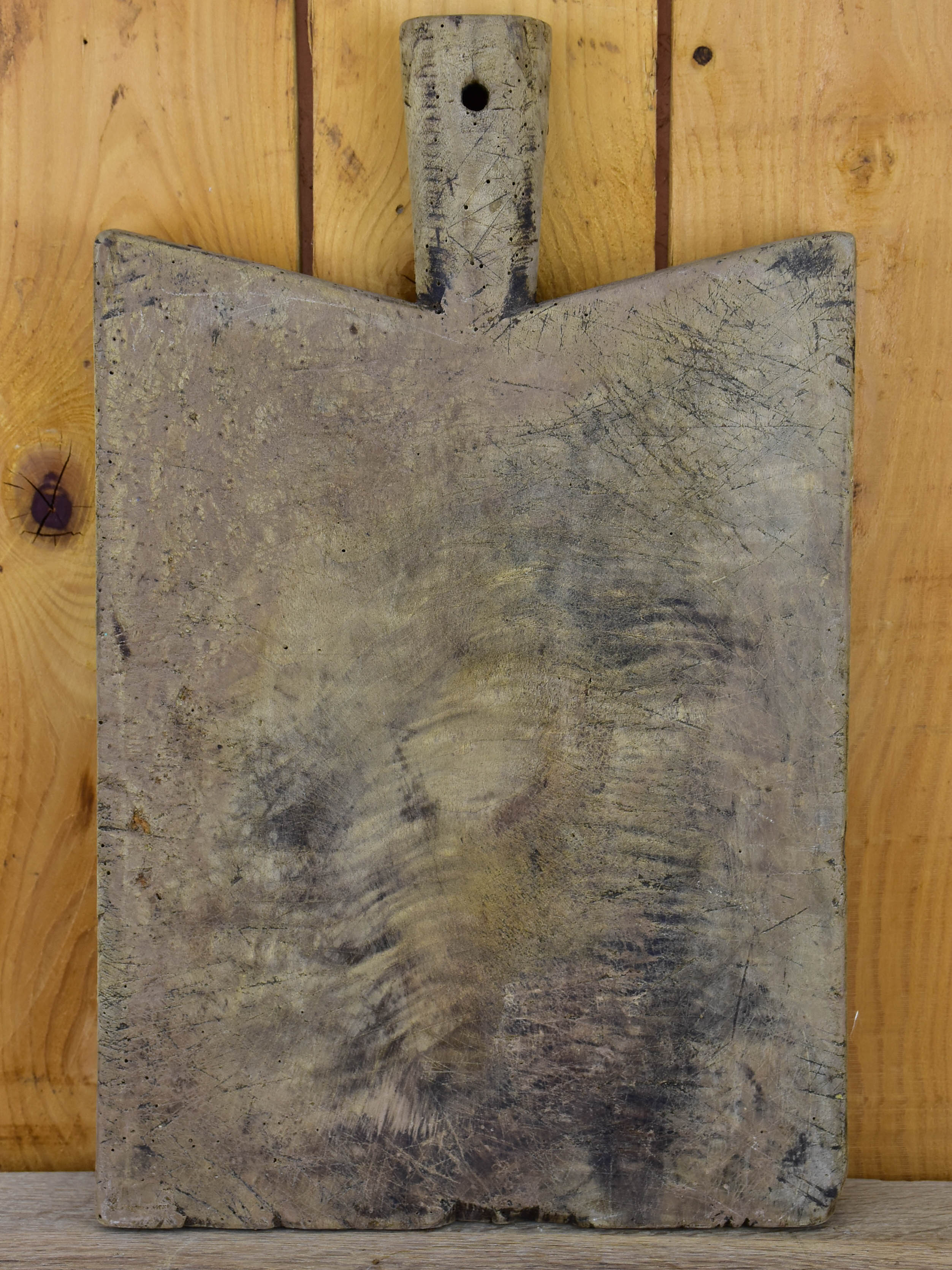 Antique French cutting board with peaked shoulders