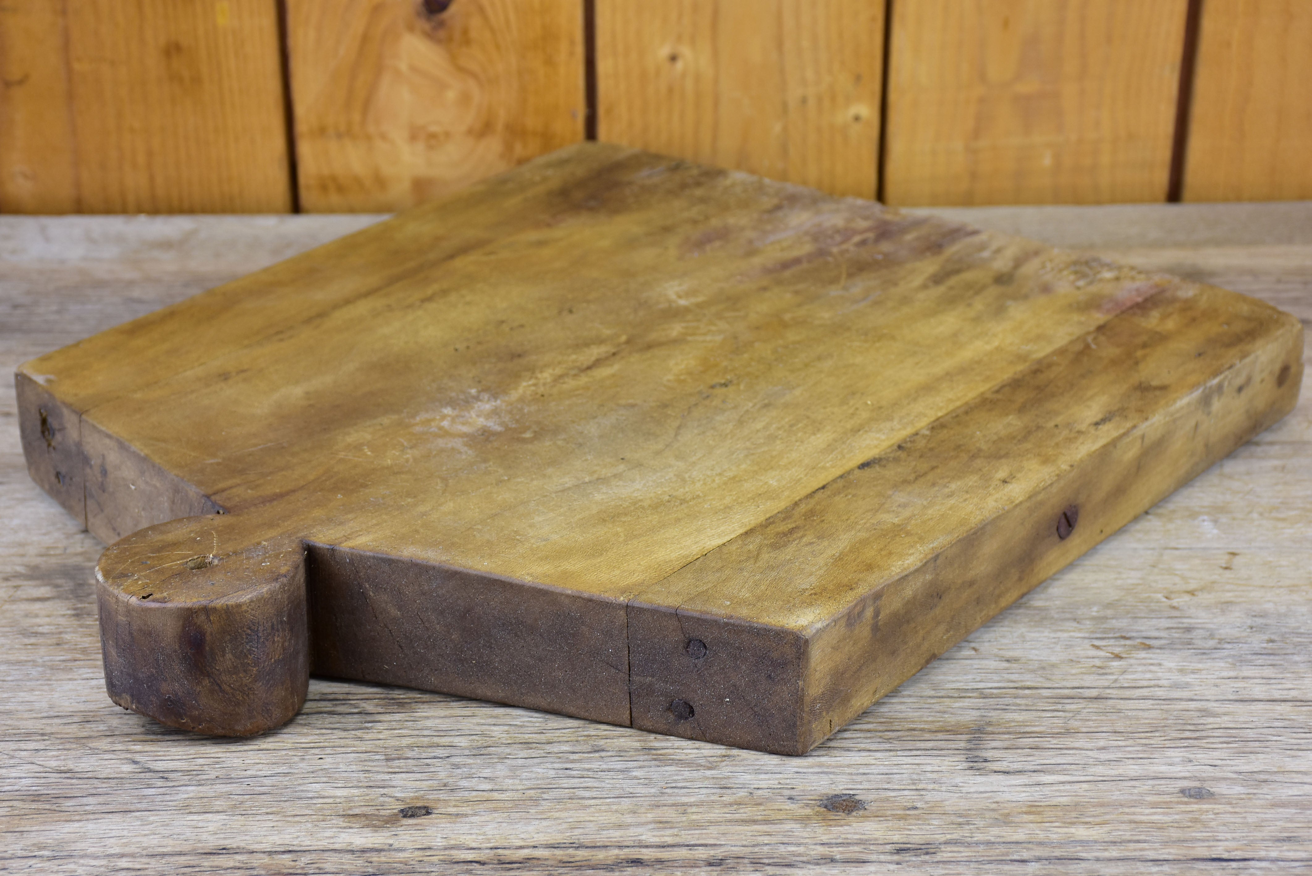 Antique French cutting board in the shape of a coat hanger