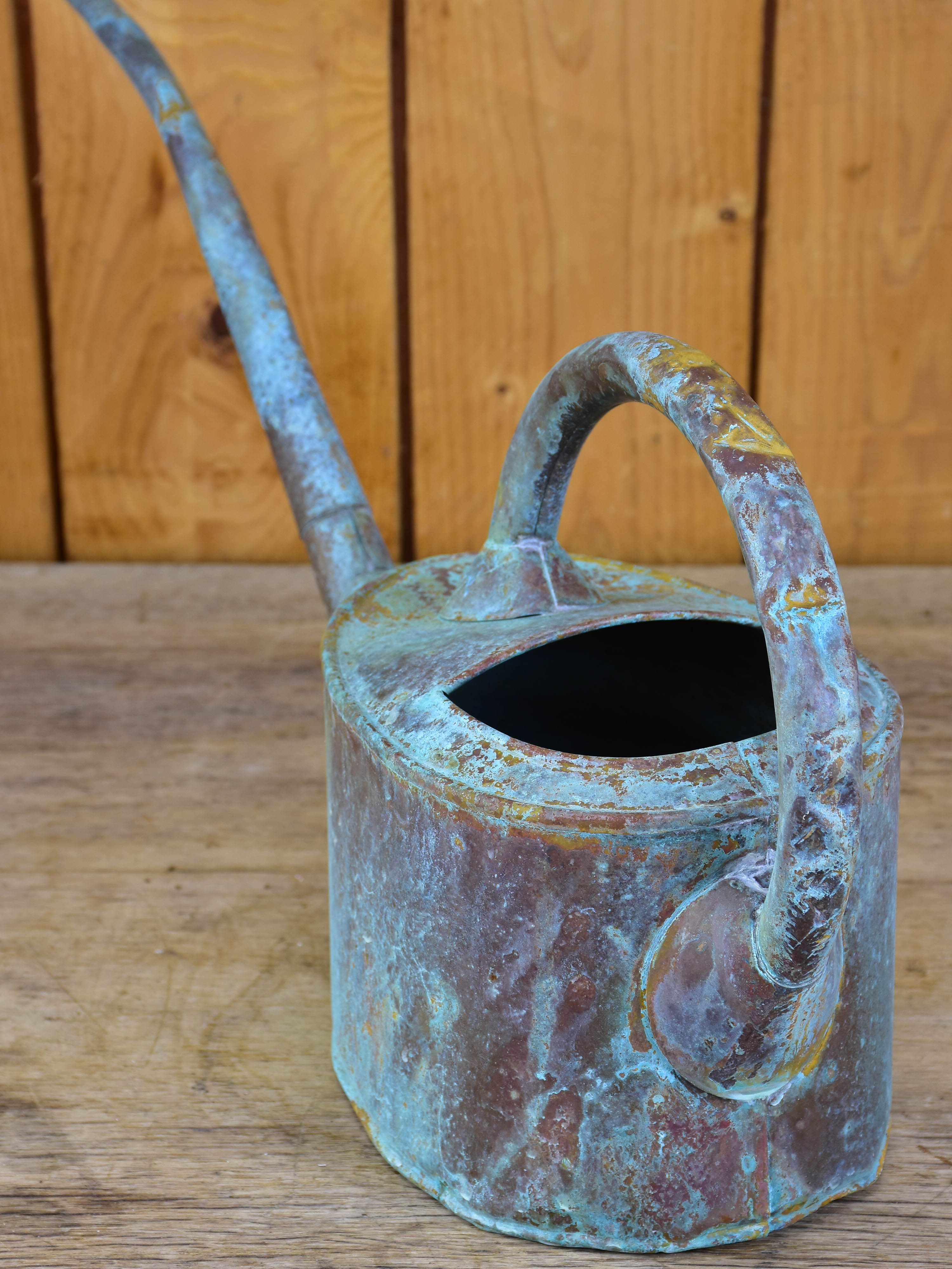 Small zinc watering can with long spout and blue patina