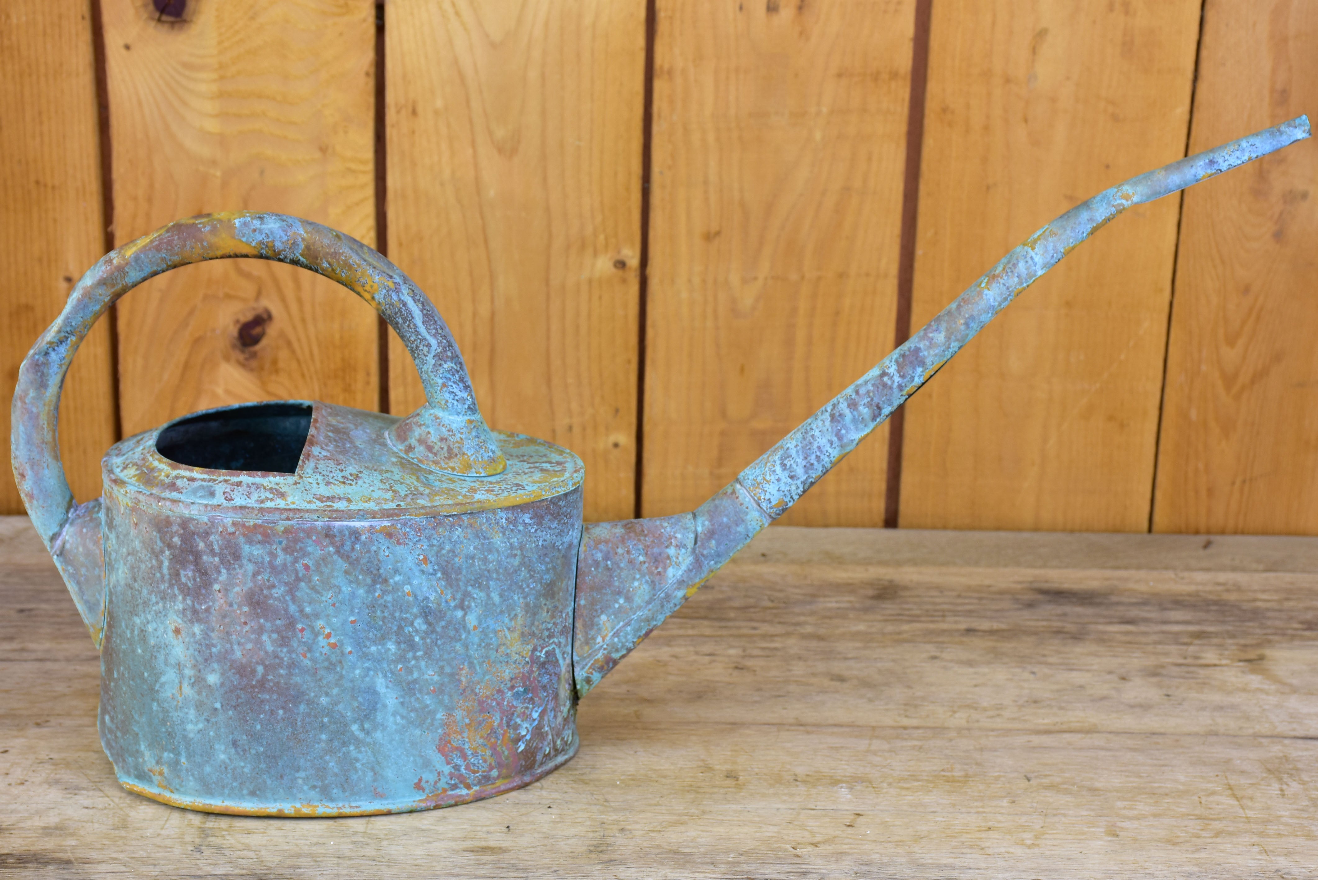 Small zinc watering can with long spout and blue patina