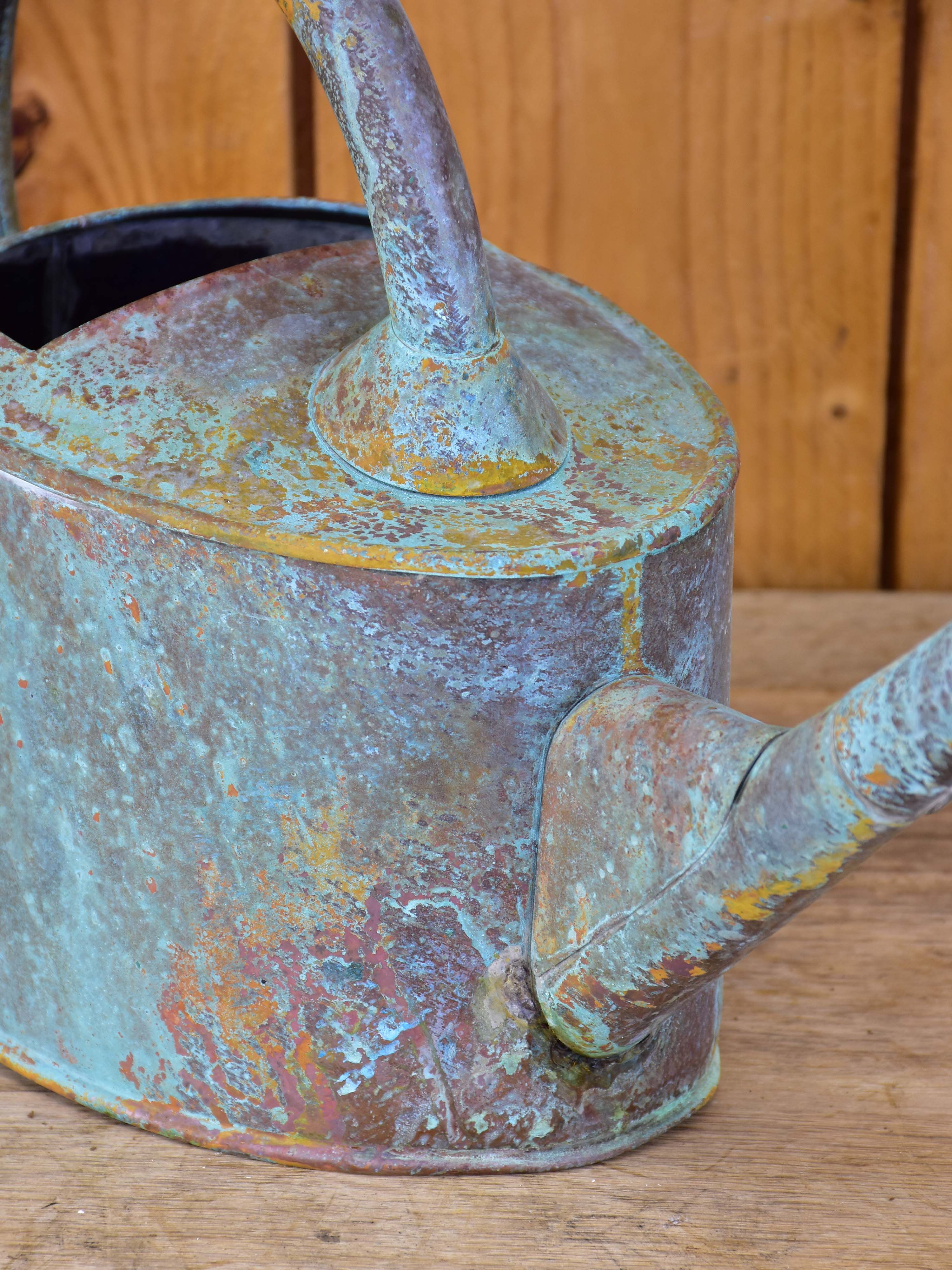 Small zinc watering can with long spout and blue patina