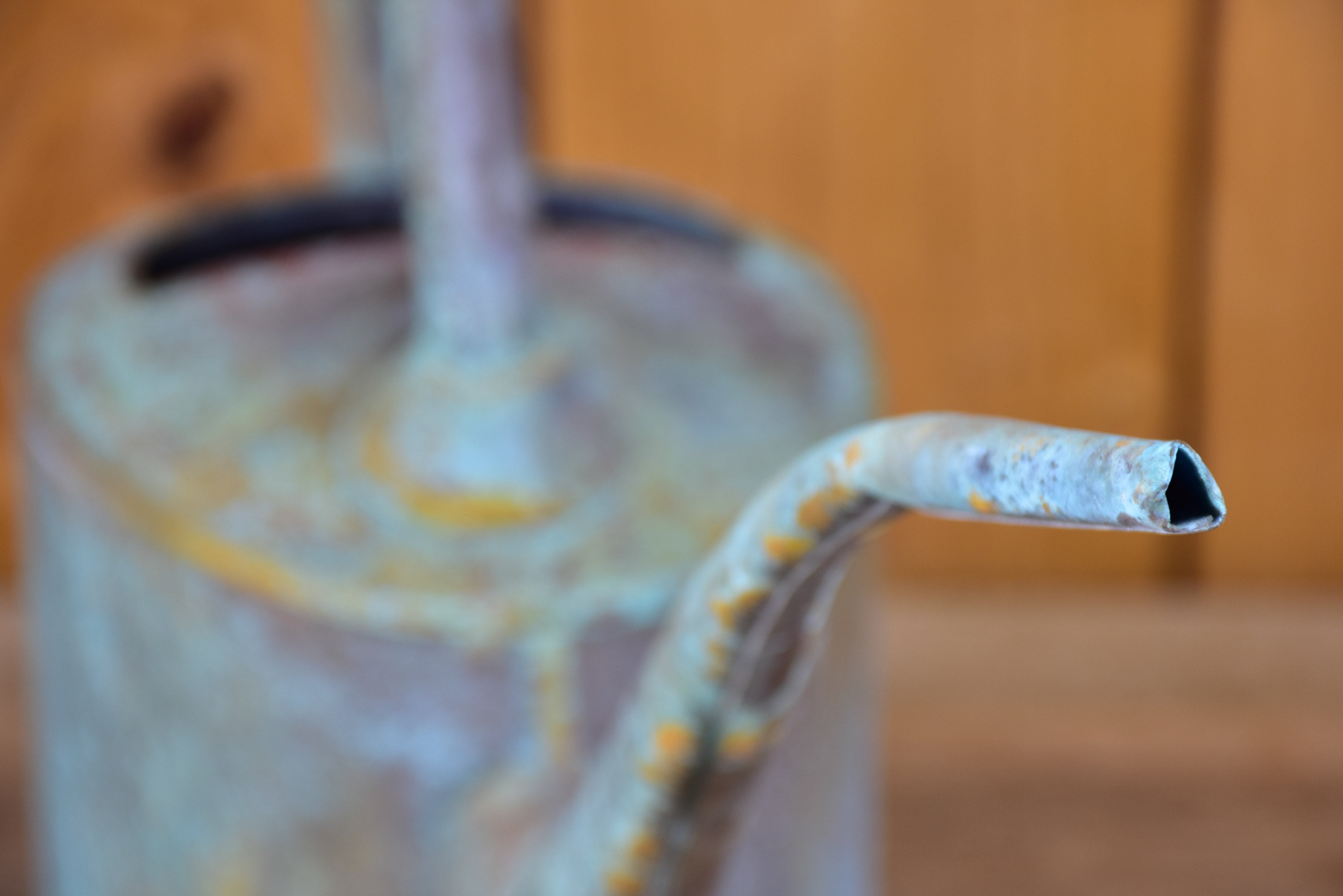 Small zinc watering can with long spout and blue patina