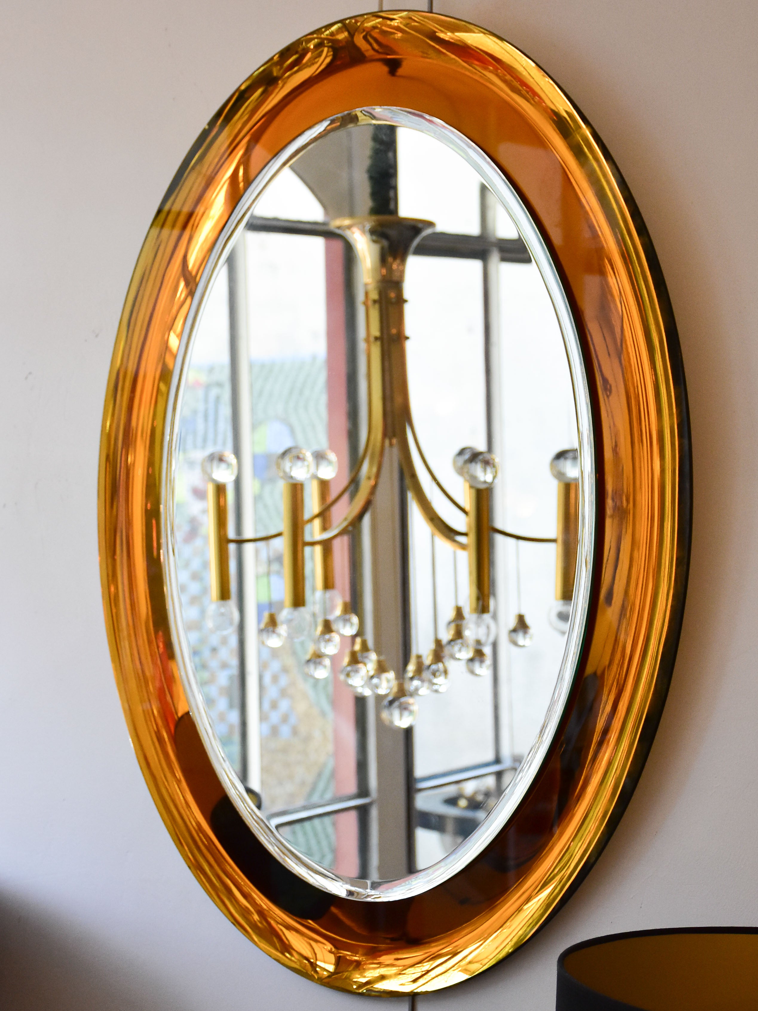 Vintage oval Metalvetro mirror with amber frame