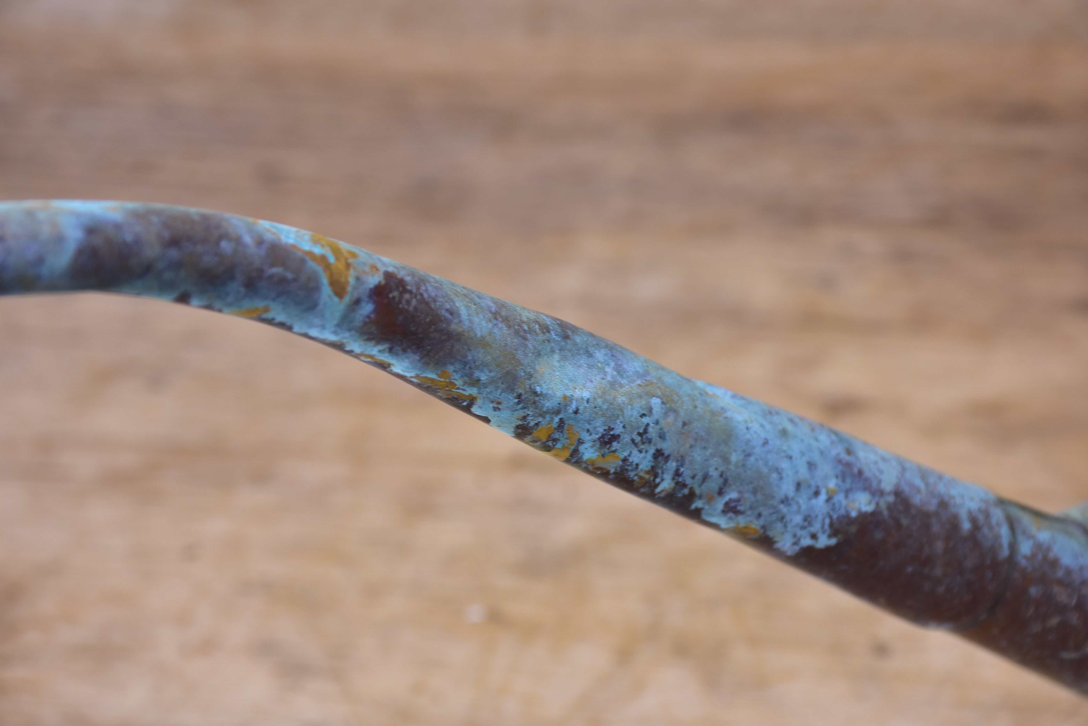 Small zinc watering can with long spout and blue patina