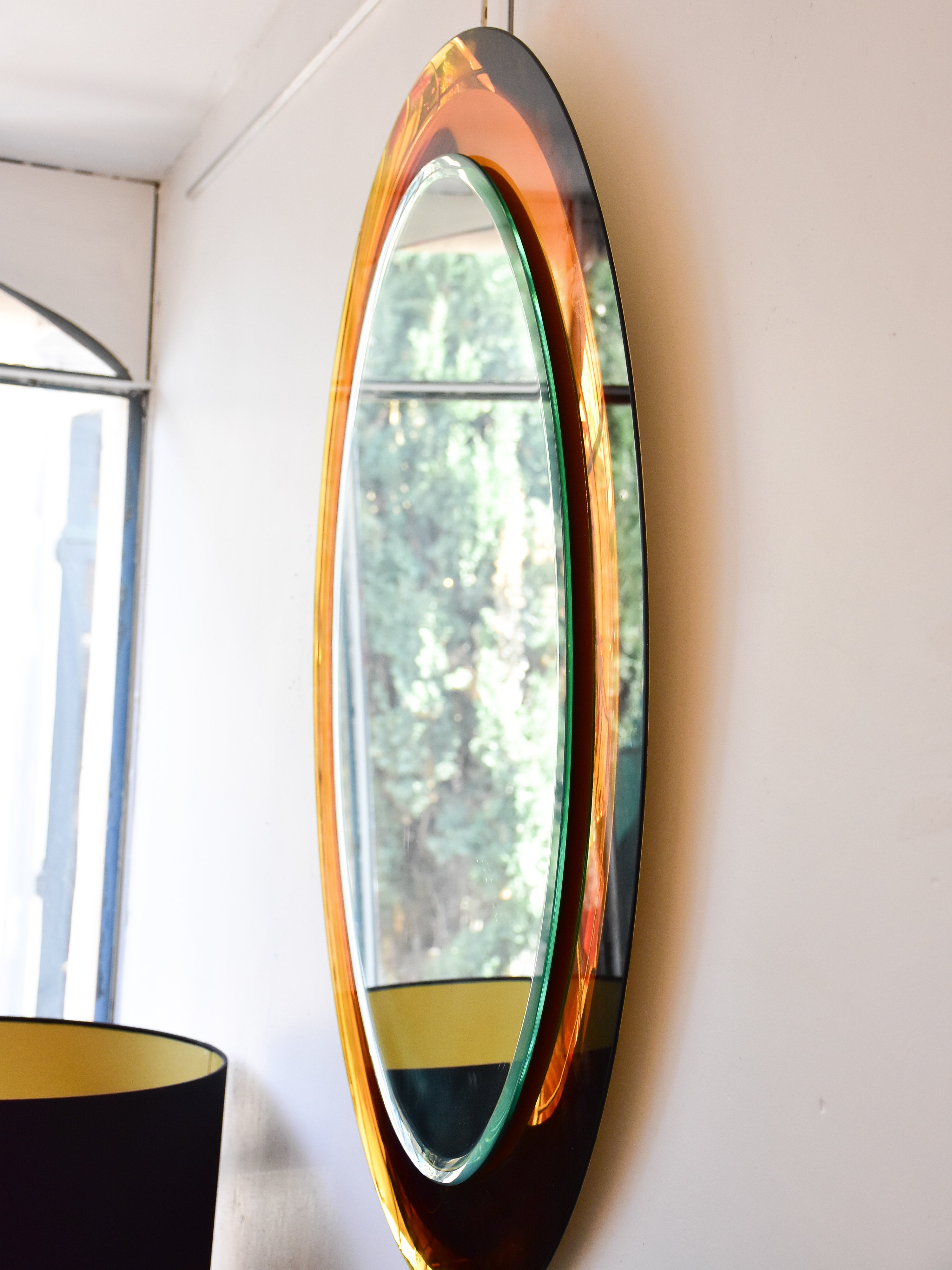 Vintage oval Metalvetro mirror with amber frame