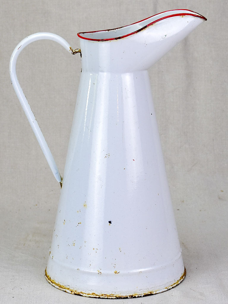 Mid century enamel pitcher - white with red rim 15"