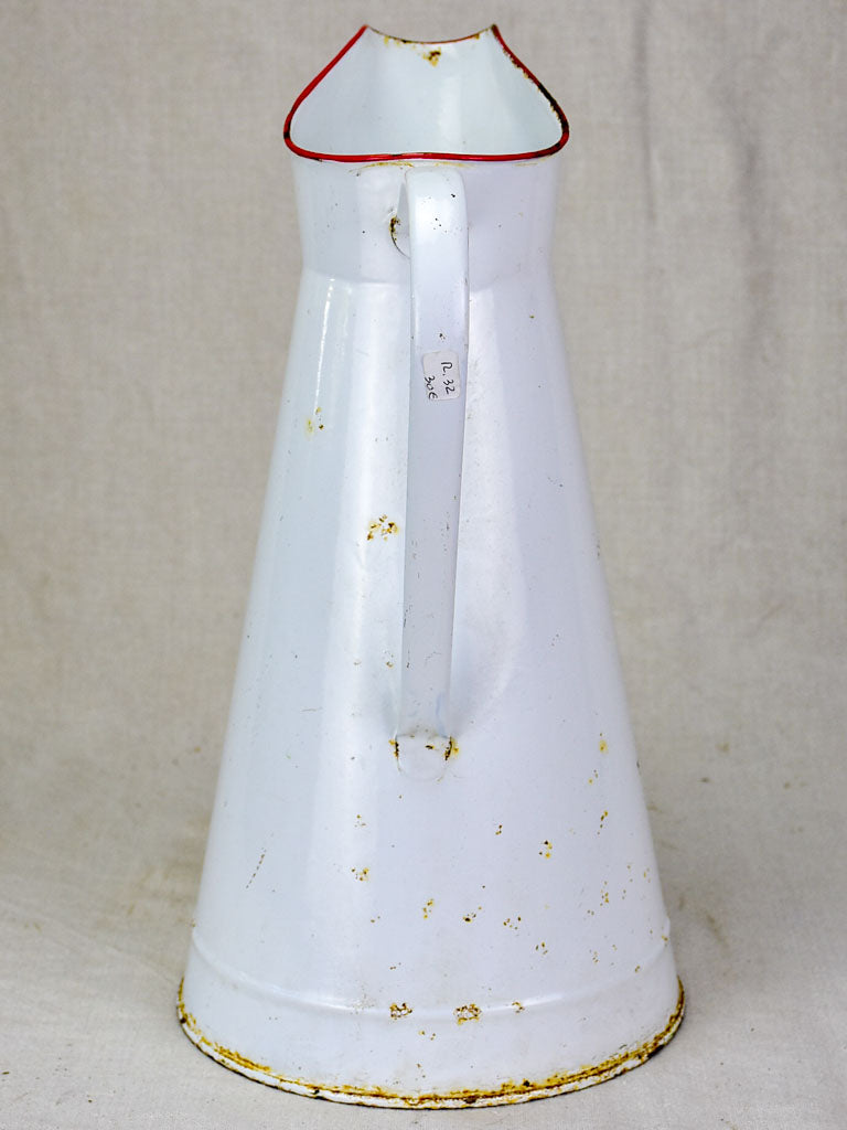 Mid century enamel pitcher - white with red rim 15"