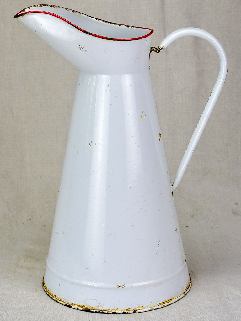 Mid century enamel pitcher - white with red rim 15"