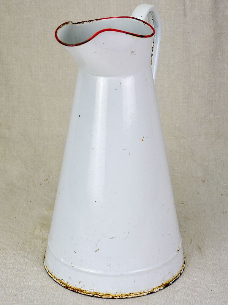 Mid century enamel pitcher - white with red rim 15"