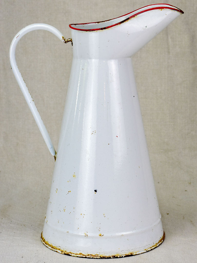 Mid century enamel pitcher - white with red rim 15"