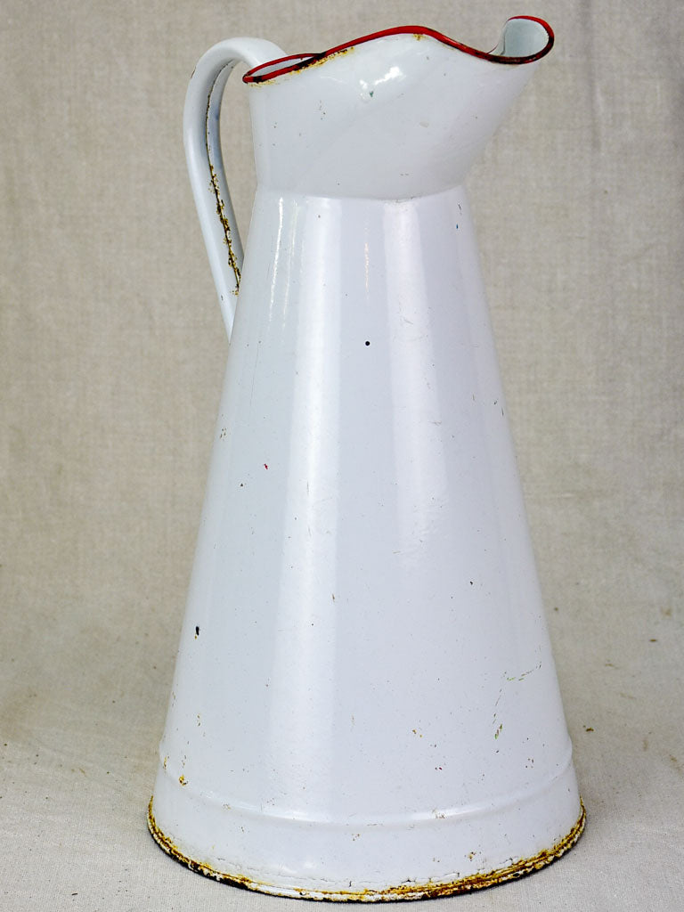 Mid century enamel pitcher - white with red rim 15"