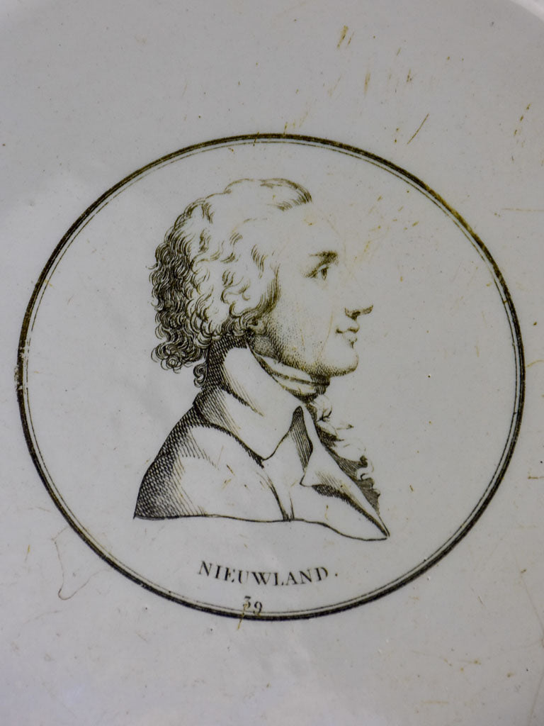 Pair of faience plates from Paris with profile portraits