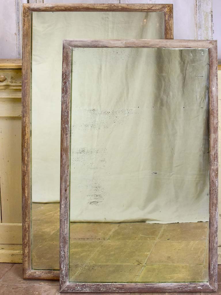 Two rustic antique French mirrors with timber frames