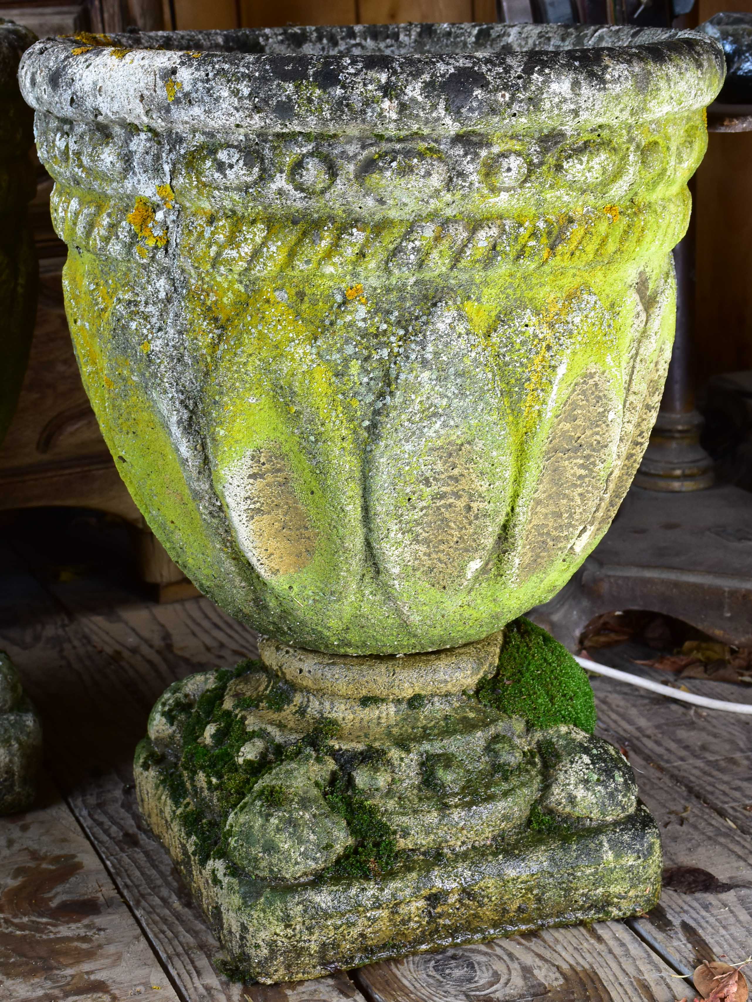 Four antique French garden pots on pedestals