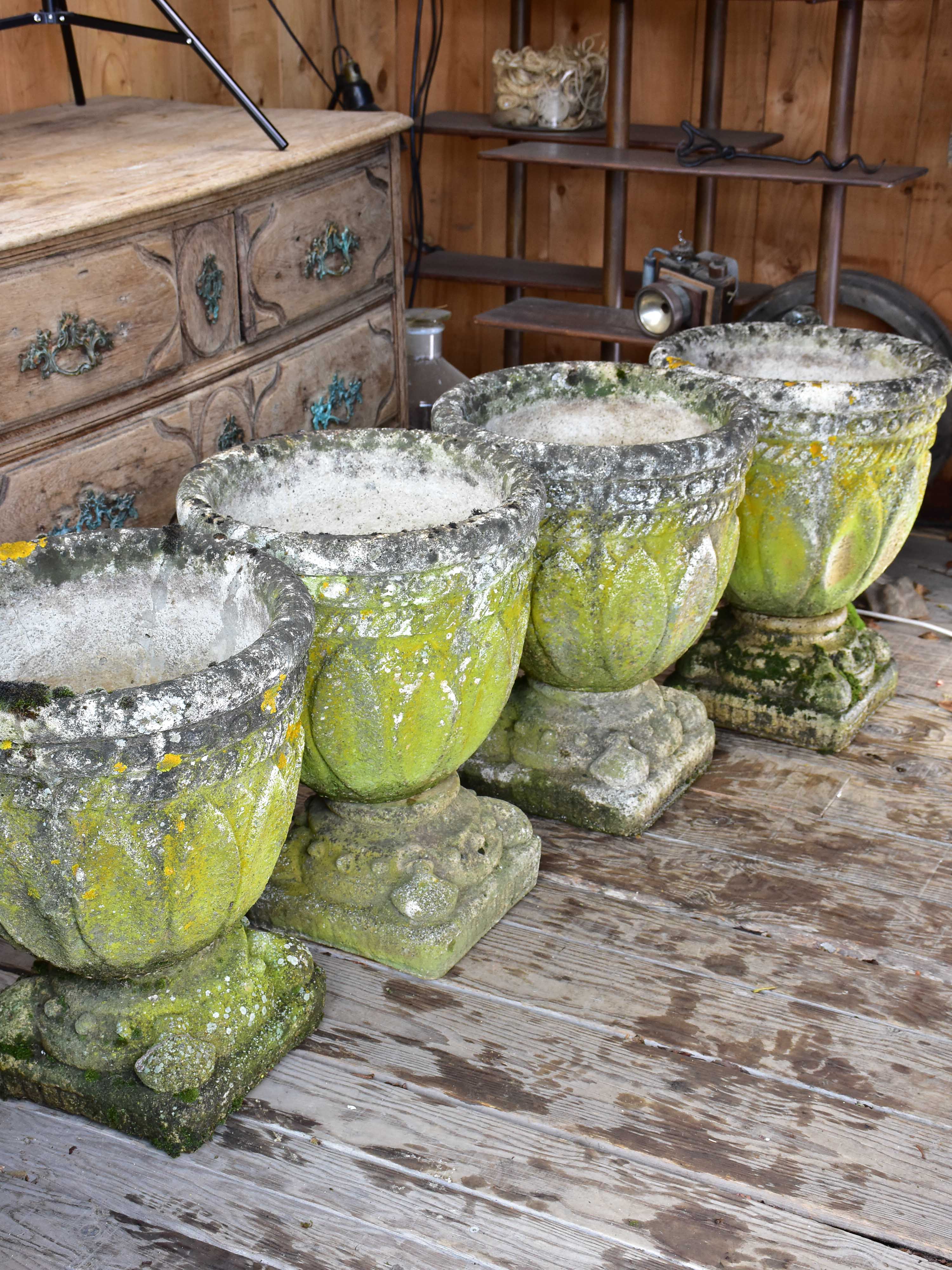 Four antique French garden pots on pedestals