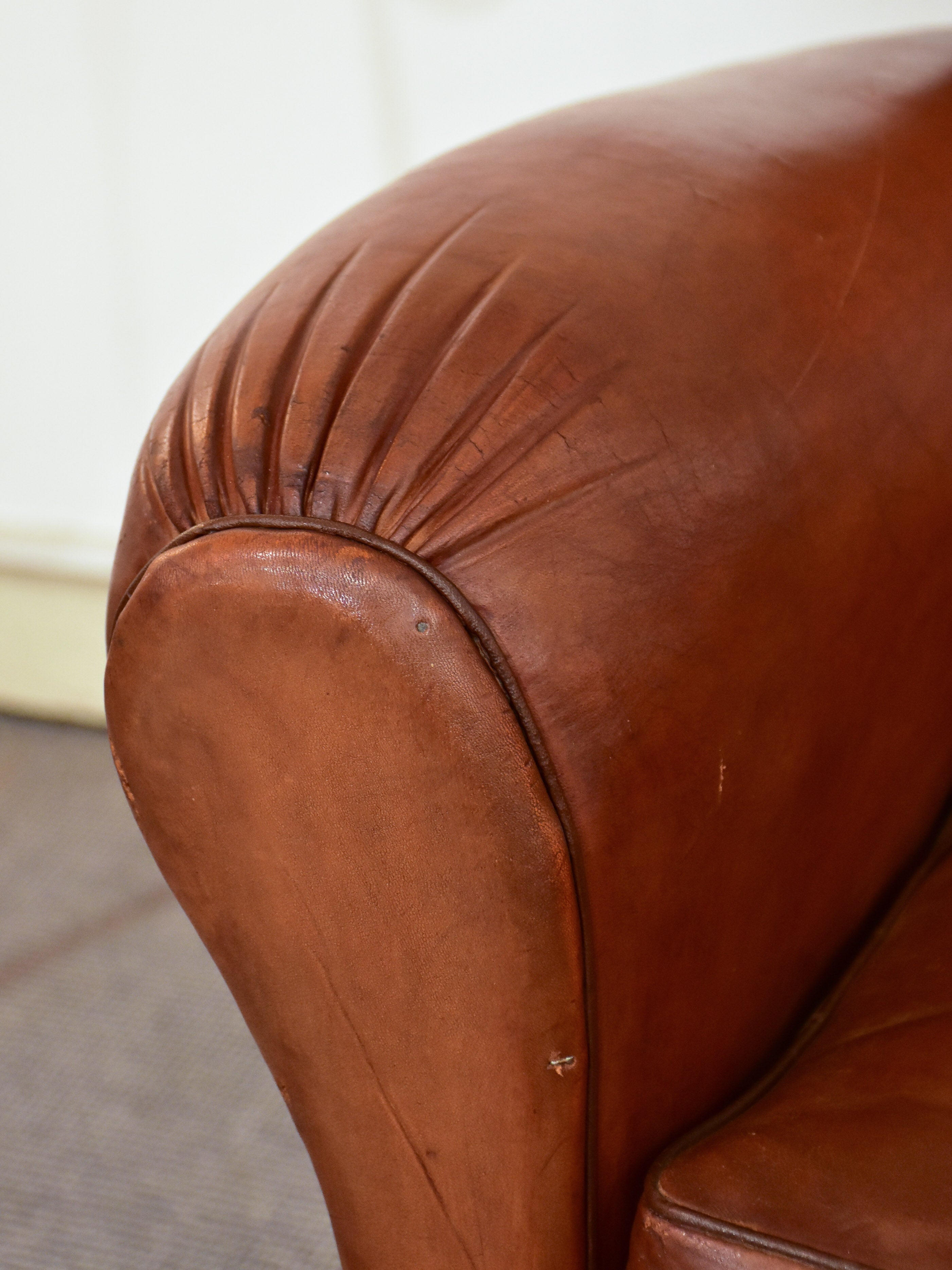 Petite 1950's French leather club chair with moustache back