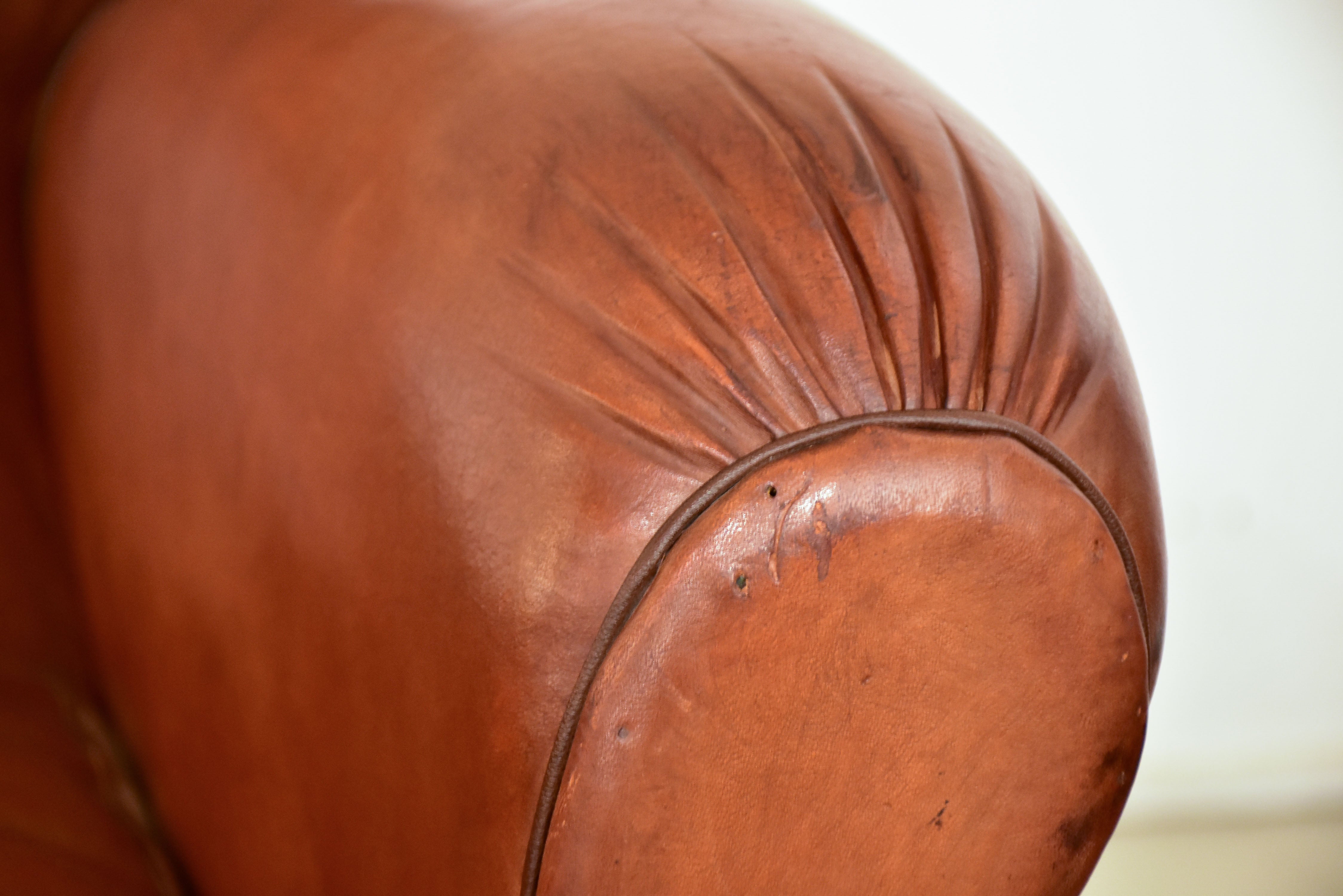 Petite 1950's French leather club chair with moustache back