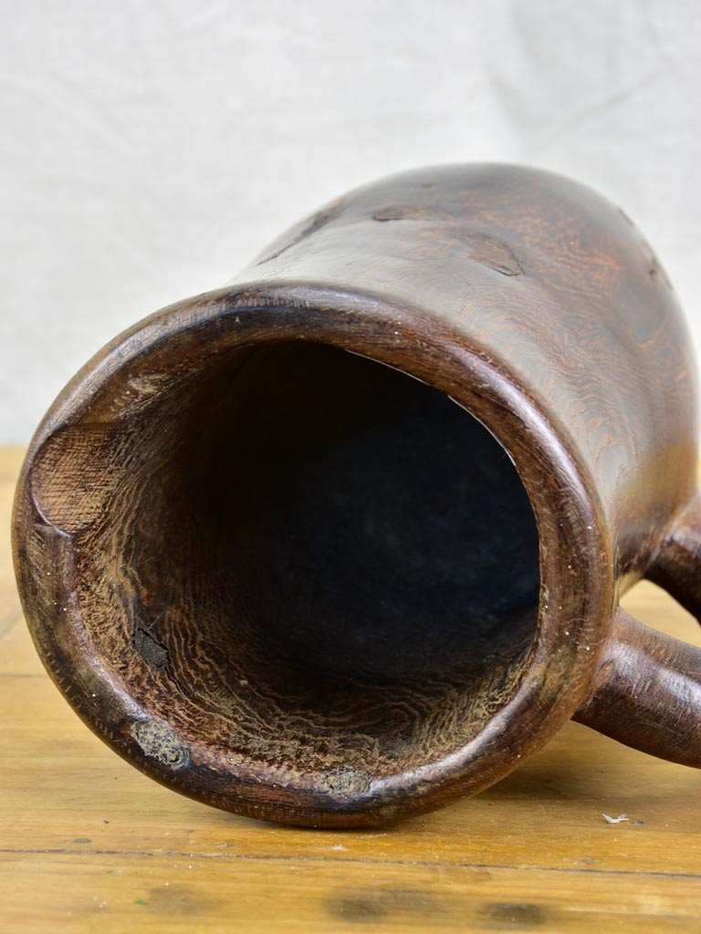 Primitive carved wooden pitcher