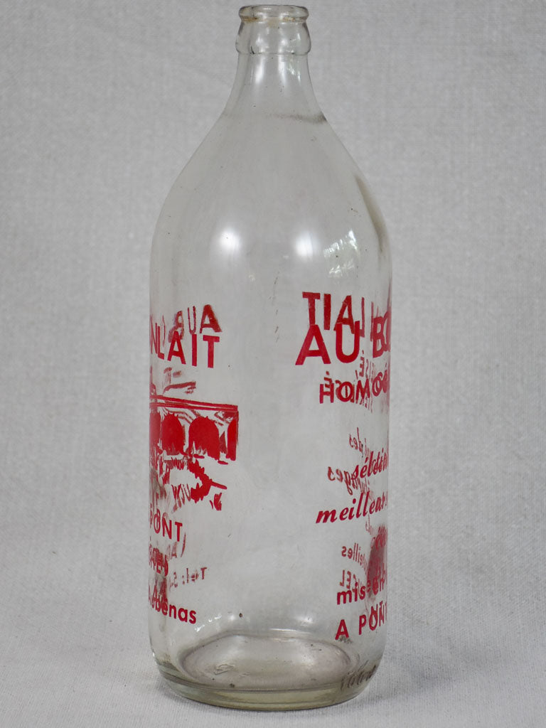 Vintage French consignment milk bottle with red label