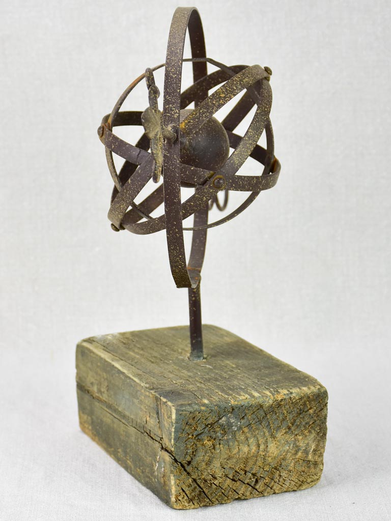 Rustic Armillary sphere mounted on a wooden block