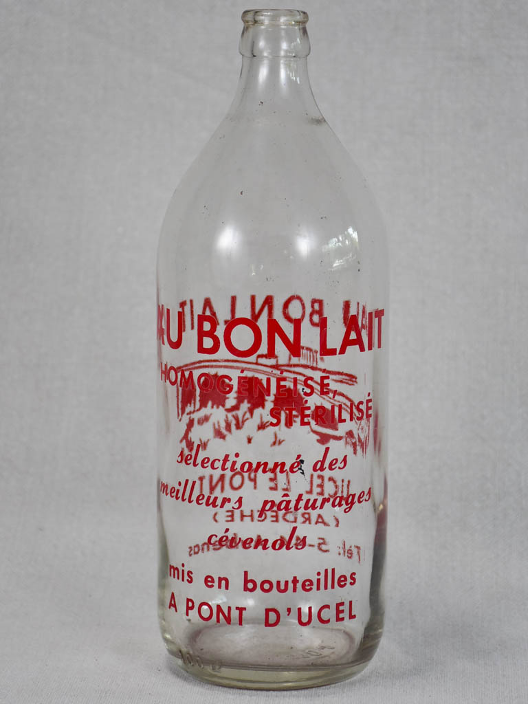 Vintage French consignment milk bottle with red label