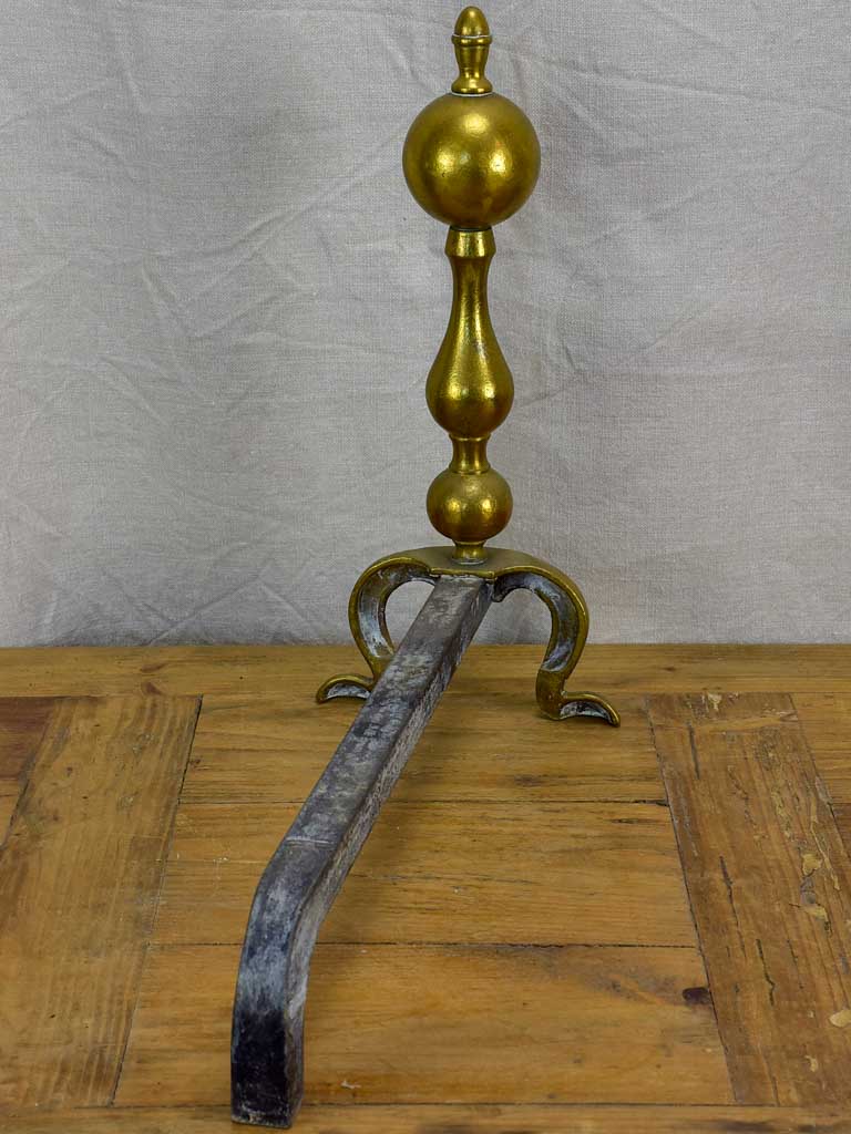 Pair of antique French andirons in brass and iron