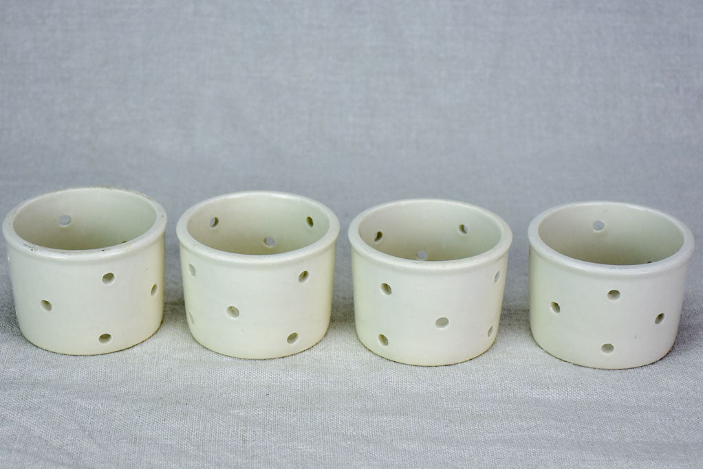 Collection of four white cheese molds #1