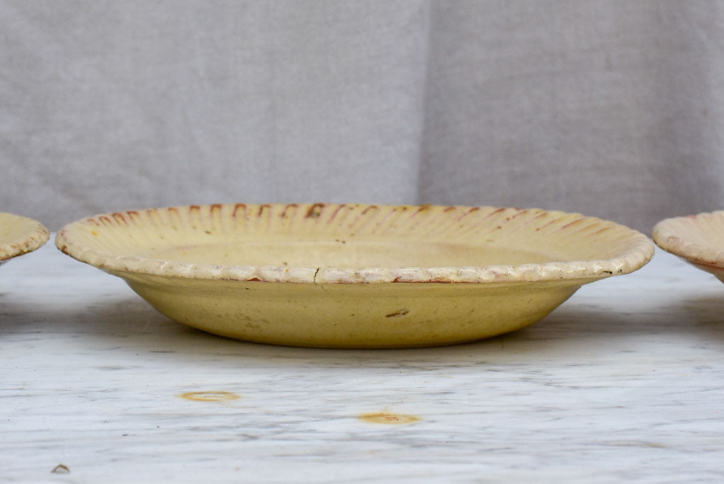 Three antique French yellow ware plates with pretty border