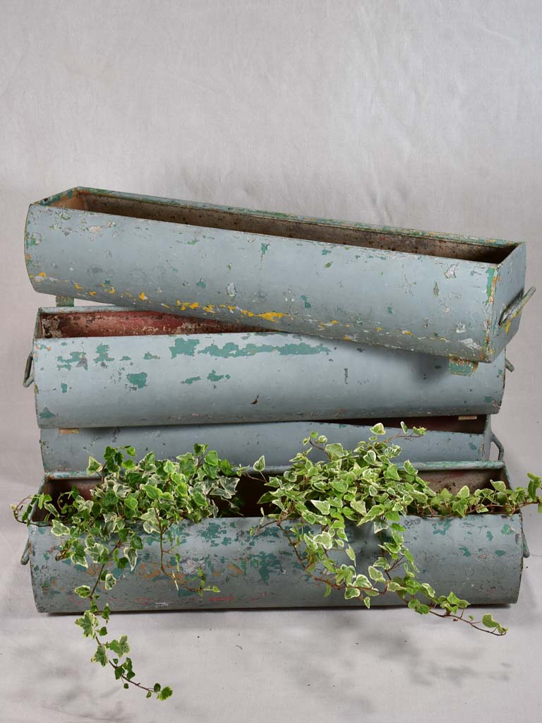 Four mid-century French window planters with blue patina 33½"