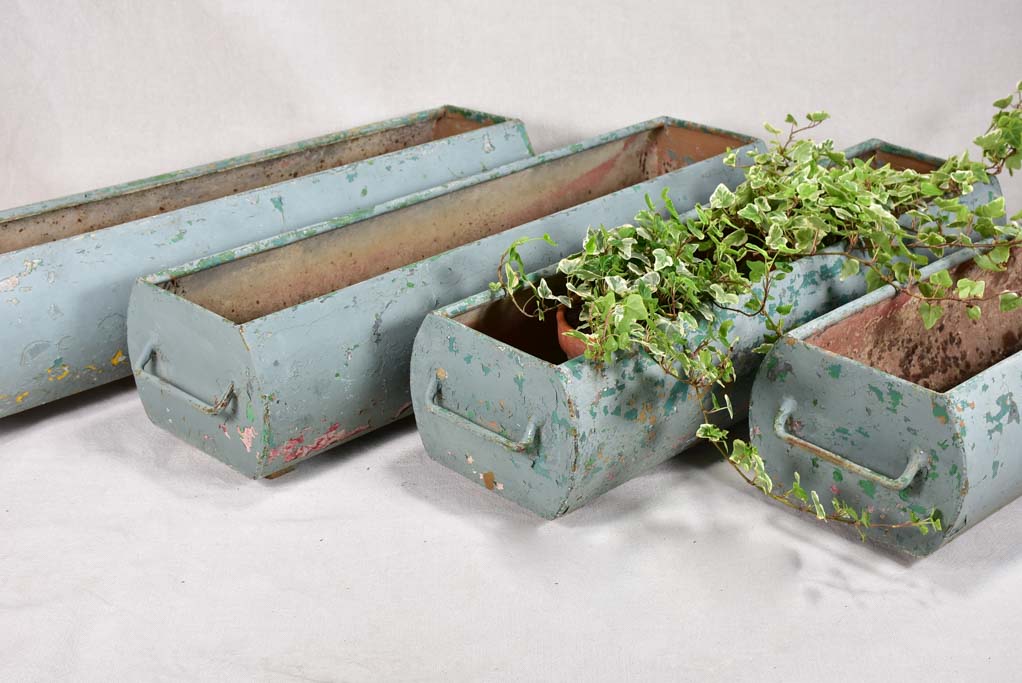 Four mid-century French window planters with blue patina 33½"