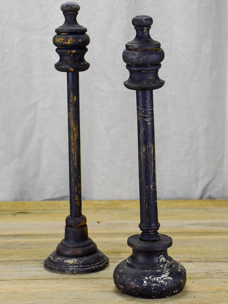 Two hat stands with black patina