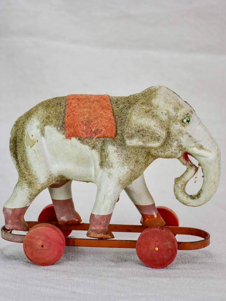 Antique French toy elephant on wheels - small