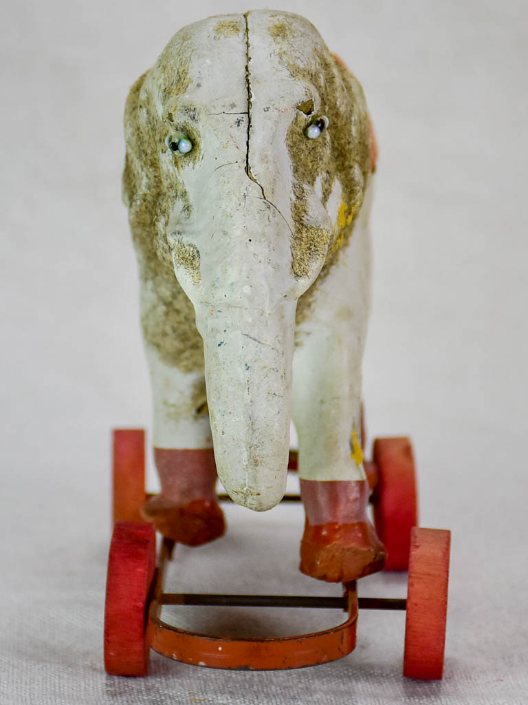 Antique French toy elephant on wheels - small