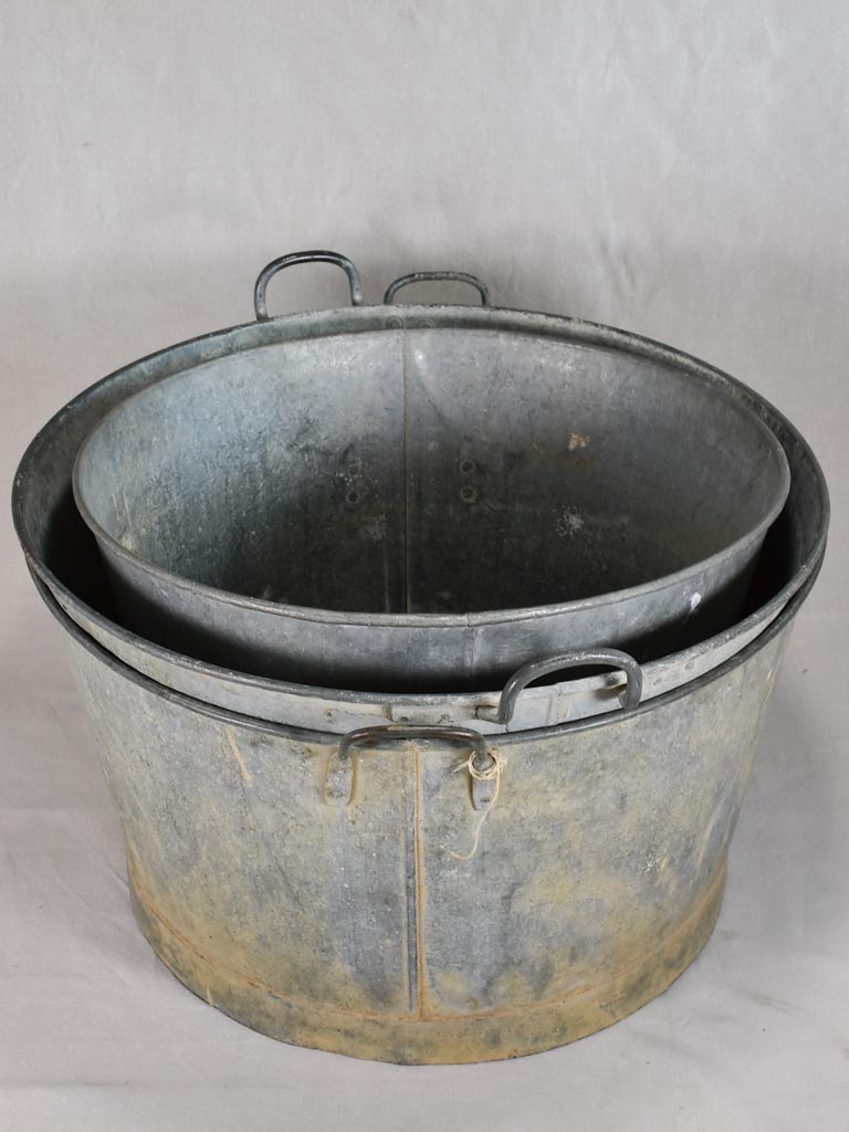 Three antique French zinc wash basins 27½"