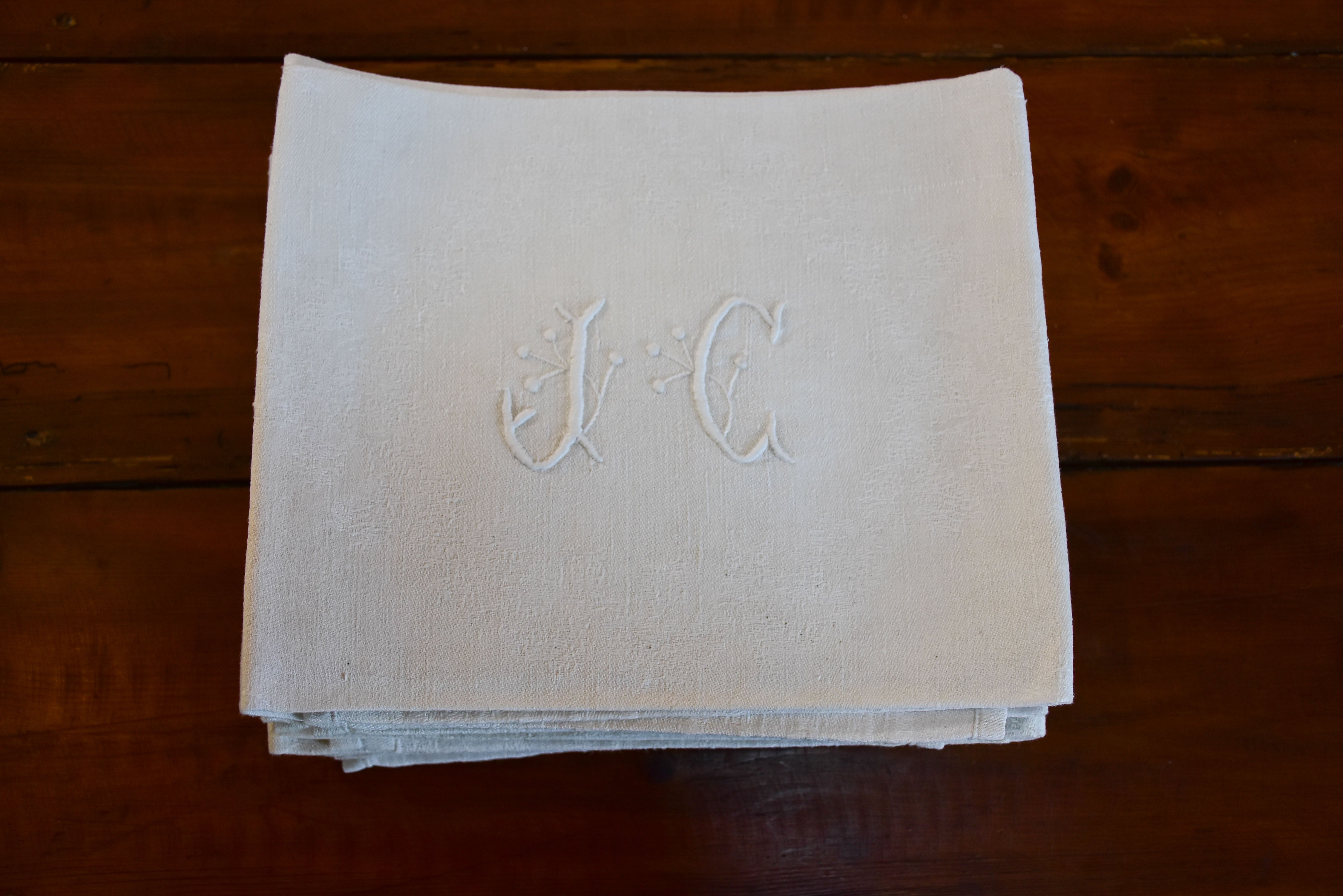 Set of 11 vintage French linen serviettes with JC monogram