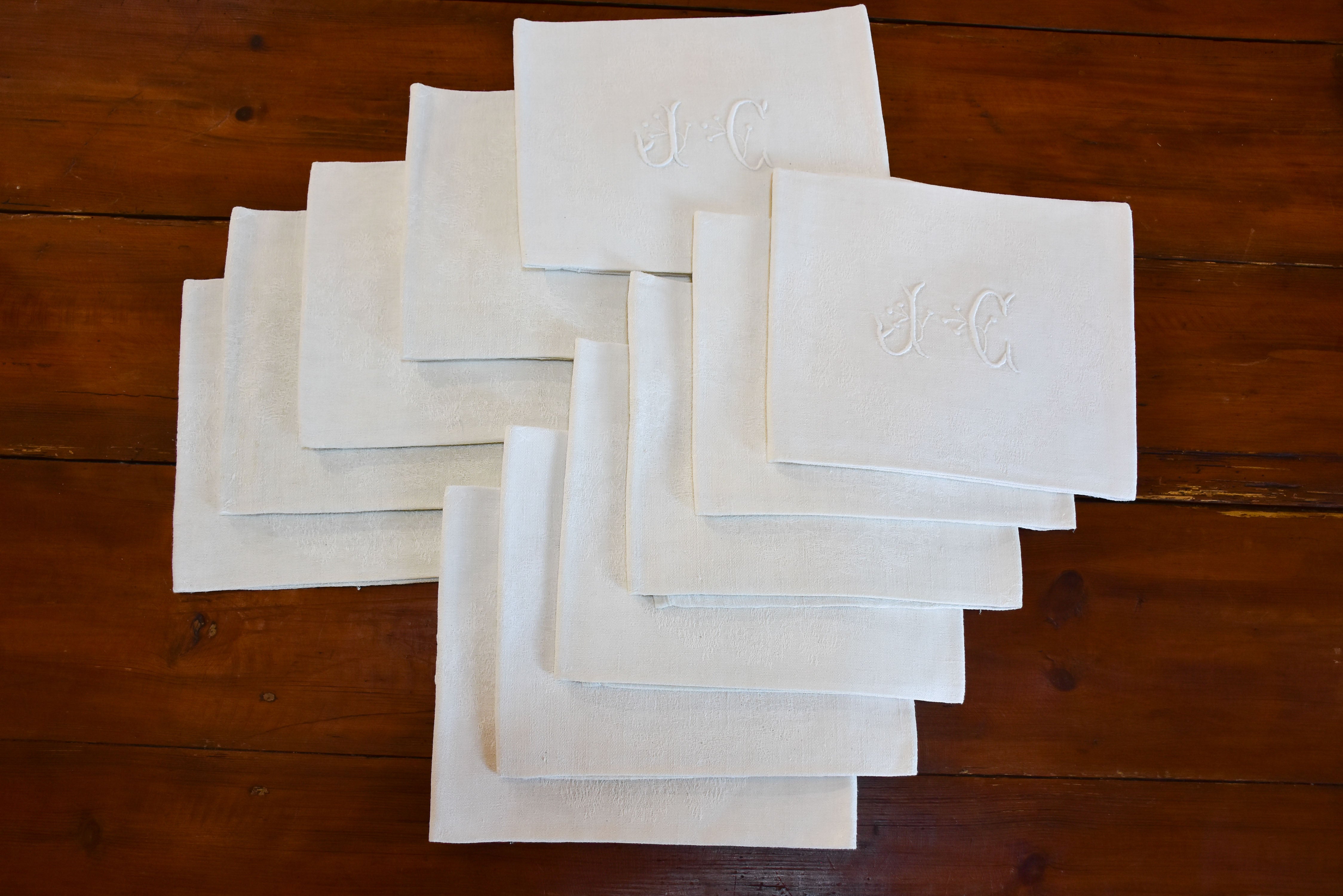 Set of 11 vintage French linen serviettes with JC monogram