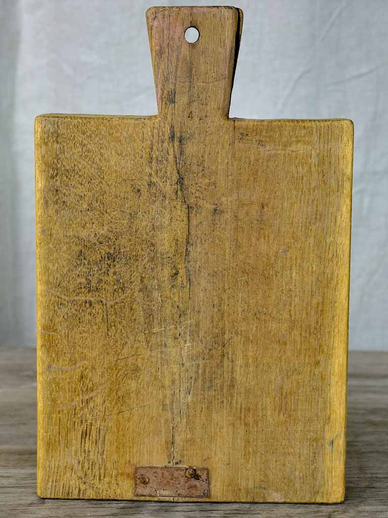 Small antique French cutting board with repairs