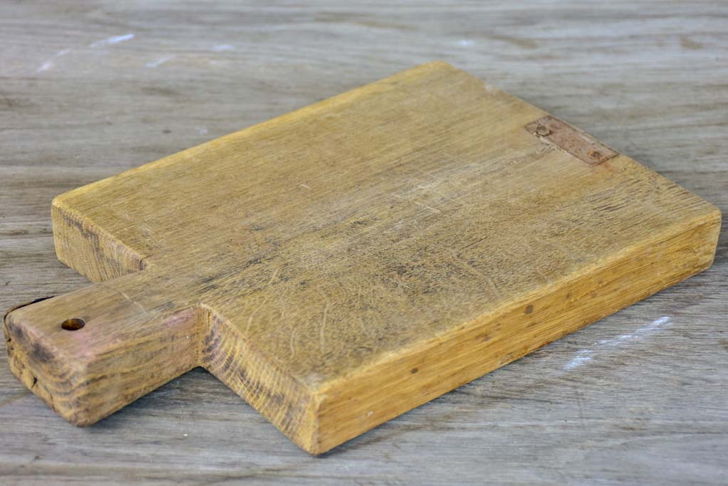 Small antique French cutting board with repairs